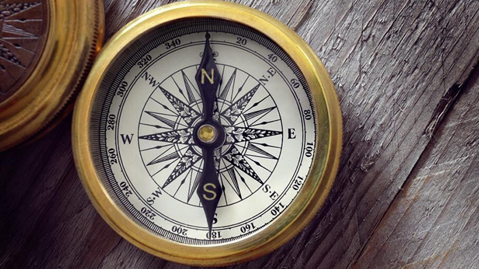 compass laying on a table